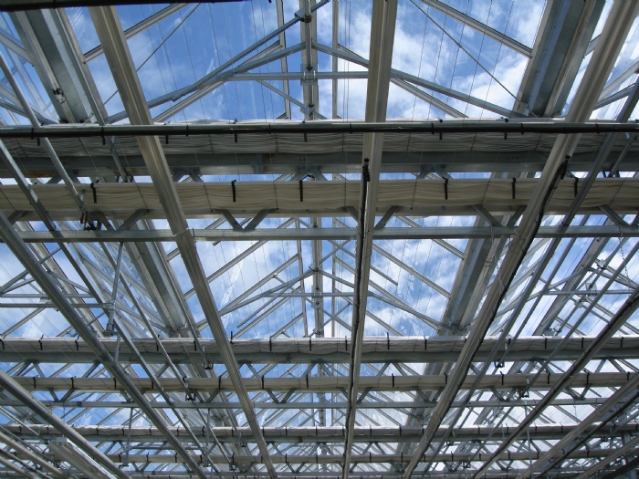 Two greenhouse shade systems used for climate control in the greenhouse.