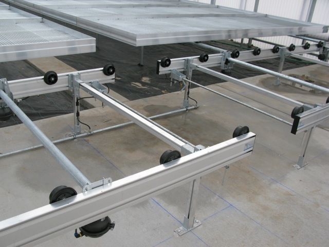 Enhance greenhouse growing with a rolling benches system, optimizing space and efficiency for large growing operations