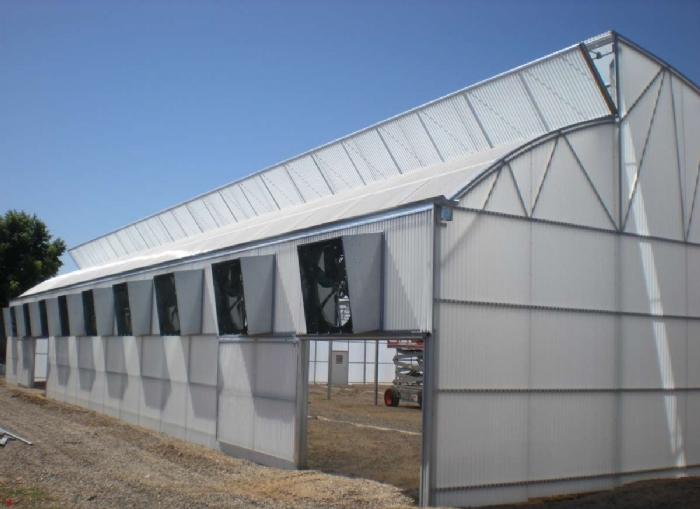 A shot of The Zephyr greenhouse designed by Prospiant with vents and fans on the side wall