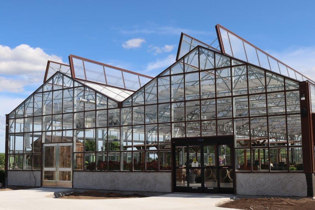 Greenhouse with top panels open for ventilation.