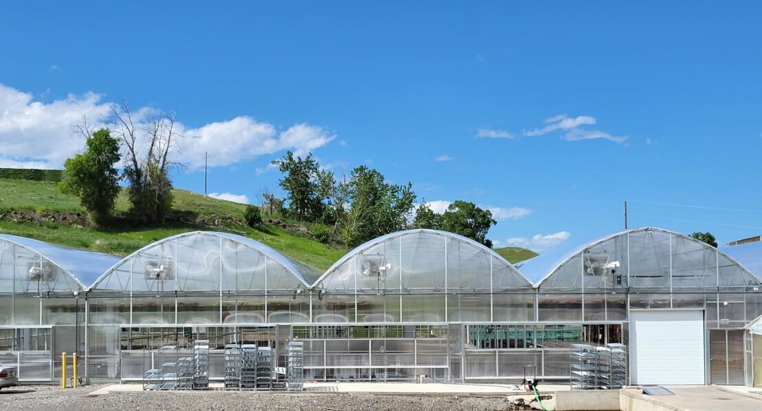 The backside of a Grand Teton production greenhouse showing passive ventilation.
