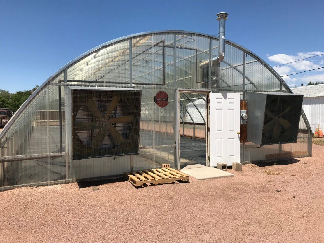 Columbine greenhouse with mechanical ventilation at Elm Avenue Greenhouse, CO.