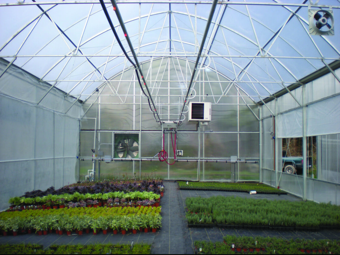 Interior of Grand Teton greenhouse with irrigation booms installed