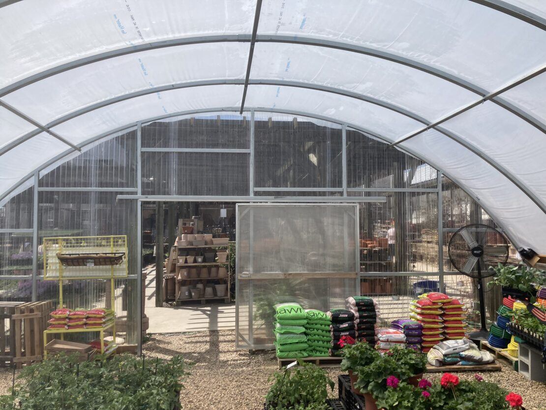 Columbine greenhouse structure used for a retail garden center.