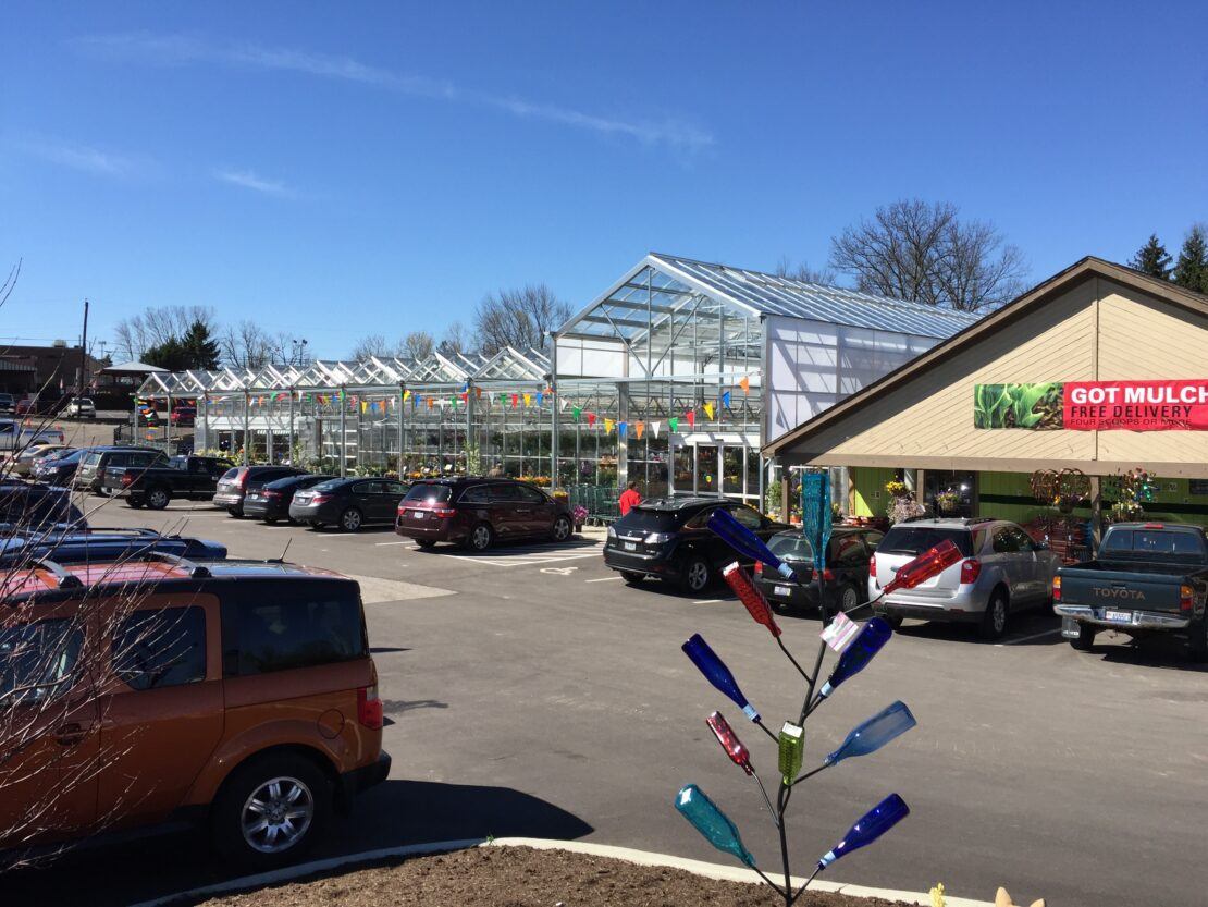 Open-roof retail greenhouse with A-frame headhouse at White Oak Gardens in Cincinnati, Ohio