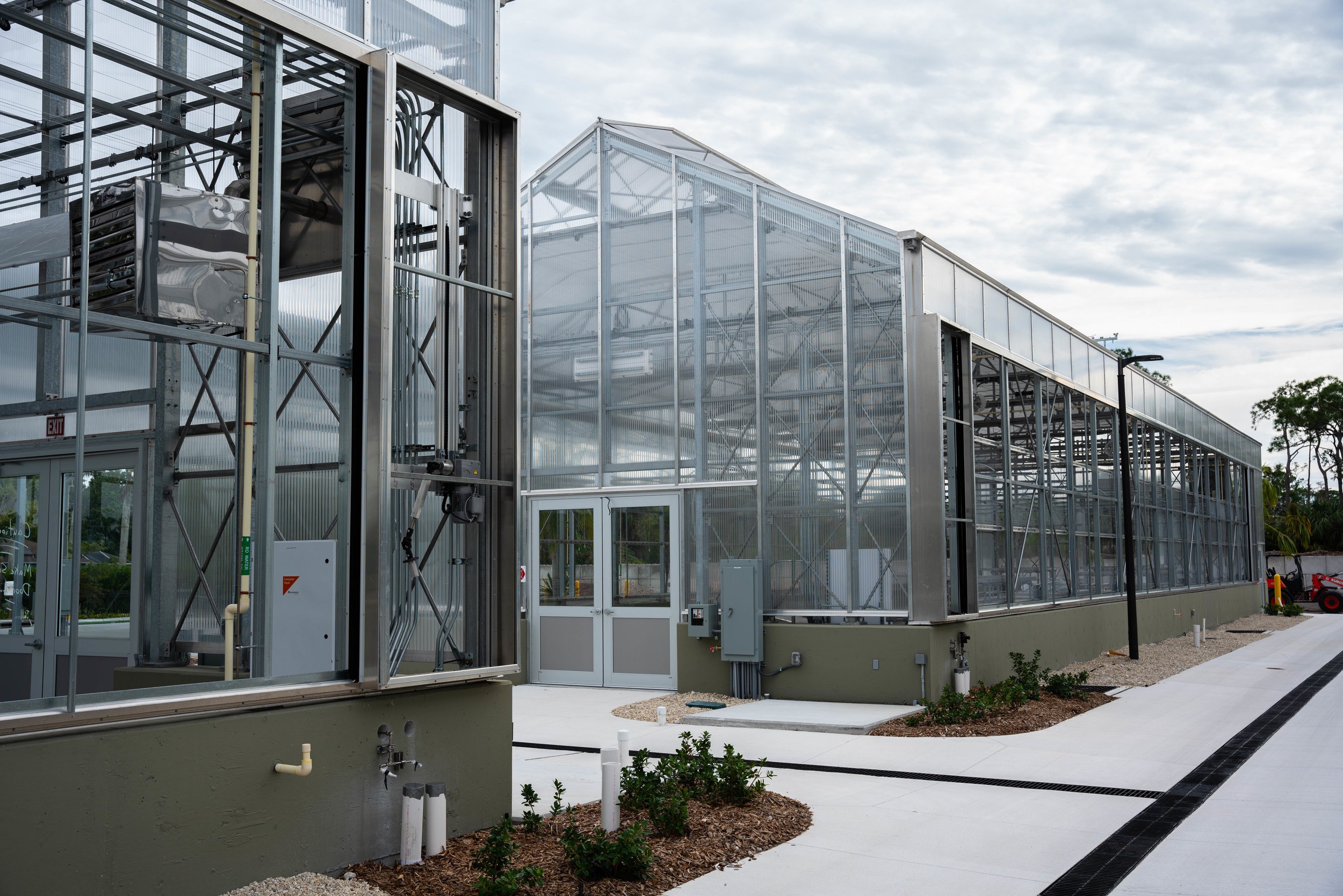 The Techlite greenhouses at Naples Botanical Garden have roll-up sides to facilitate airflow.