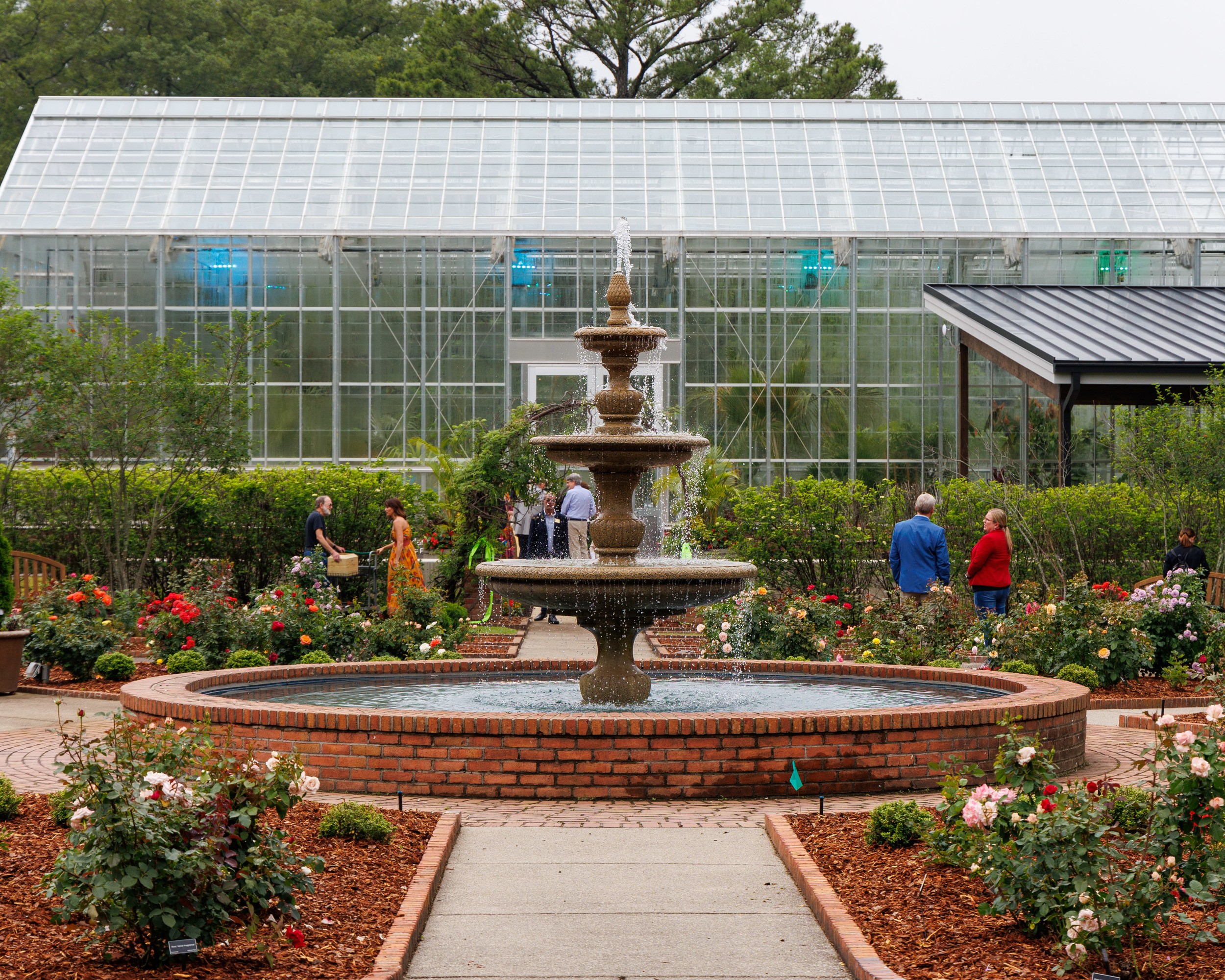 The Memphis Botanic Garden greenhouse makes a stunning background for an outdoor fountain on the grounds.