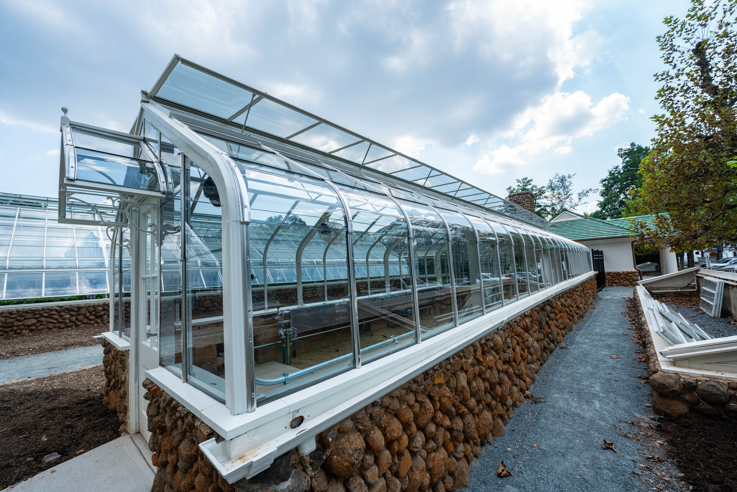 Sideview of Reynolda greenhouses showing the curved glass and ridge vent