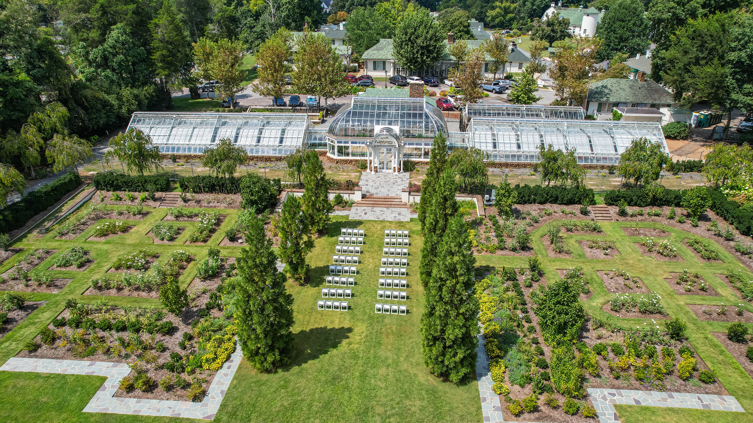 Aerial view of Reynolda Conservatory showing main greenhouses flanked by two connecting greenhouses