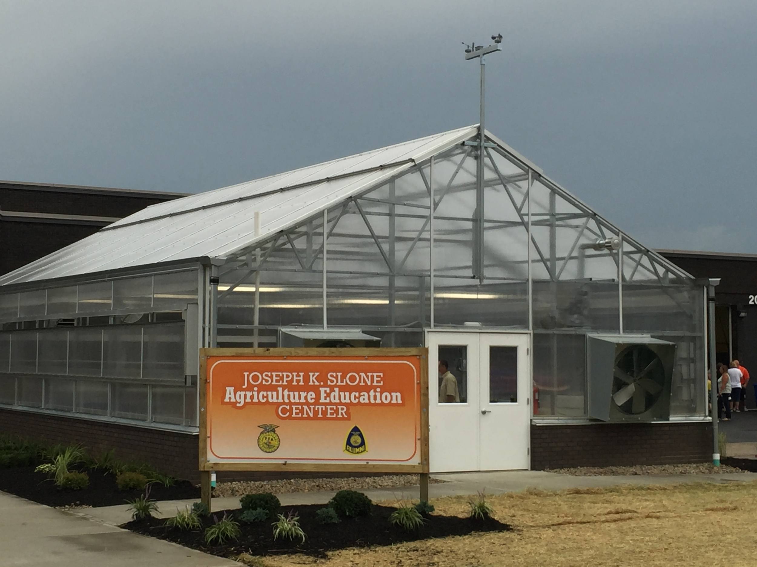 The Classroom Cultivator A-frame school greenhouse includes a weather station and double-door entry
