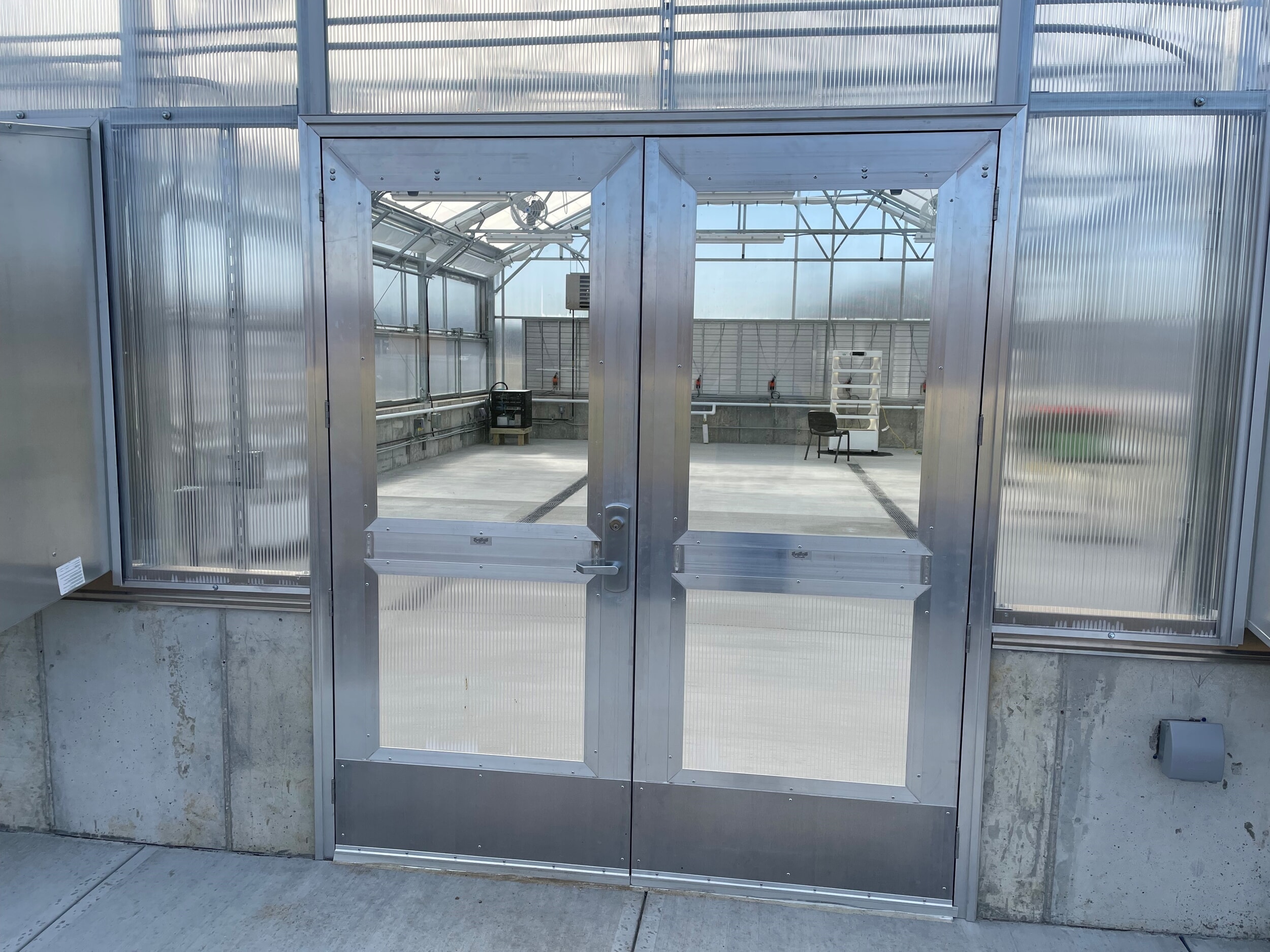Double-door entry to Classroom Cultivator school greenhouse makes it easier to move plants and equipment in and out.