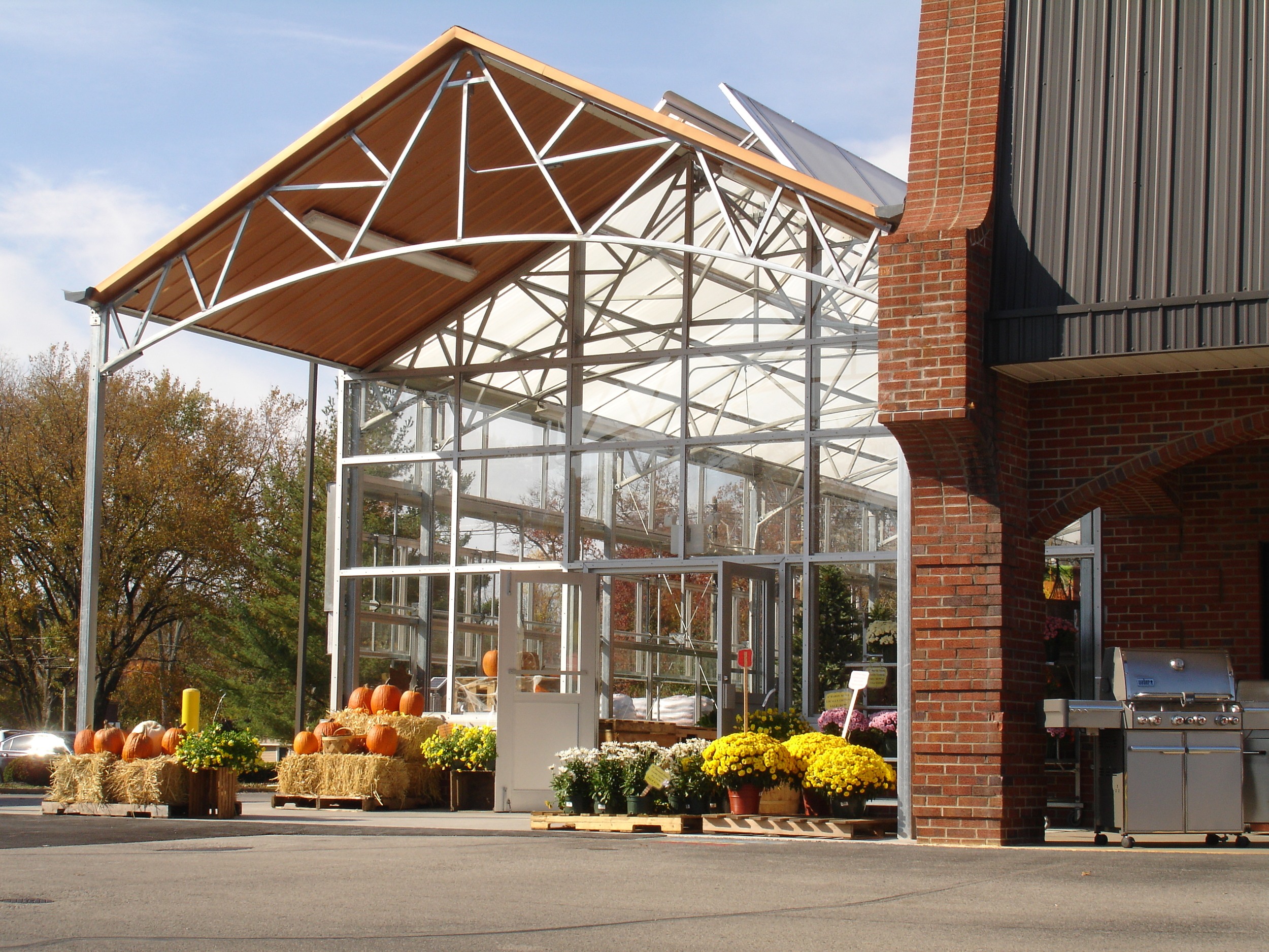 A curved bottom chord truss used on an entrance overhang at a Brownsboro hardware store and garden center.