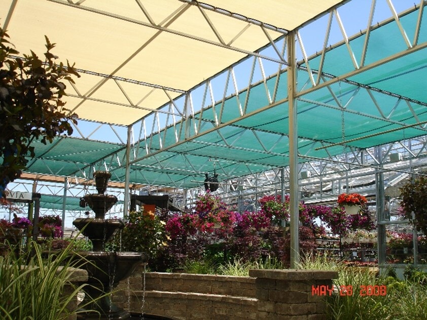 Plymouth Nursery uses ladder bar trusses to support a flat-shade structure