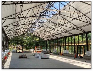 Scissor trusses create cathedral-style ceilings with lot of clearance for hanging items overhead.