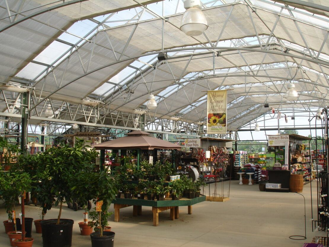 A wide curved bottom chord truss at Wilson's Garden Center adds a classic European vibe.